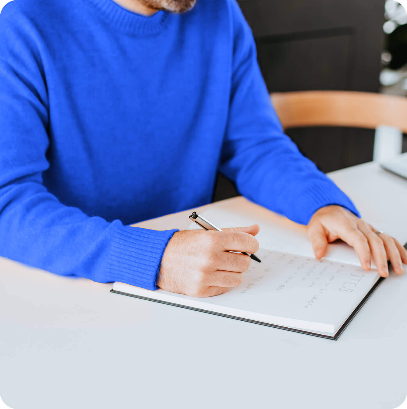 Man Writing on the notepad